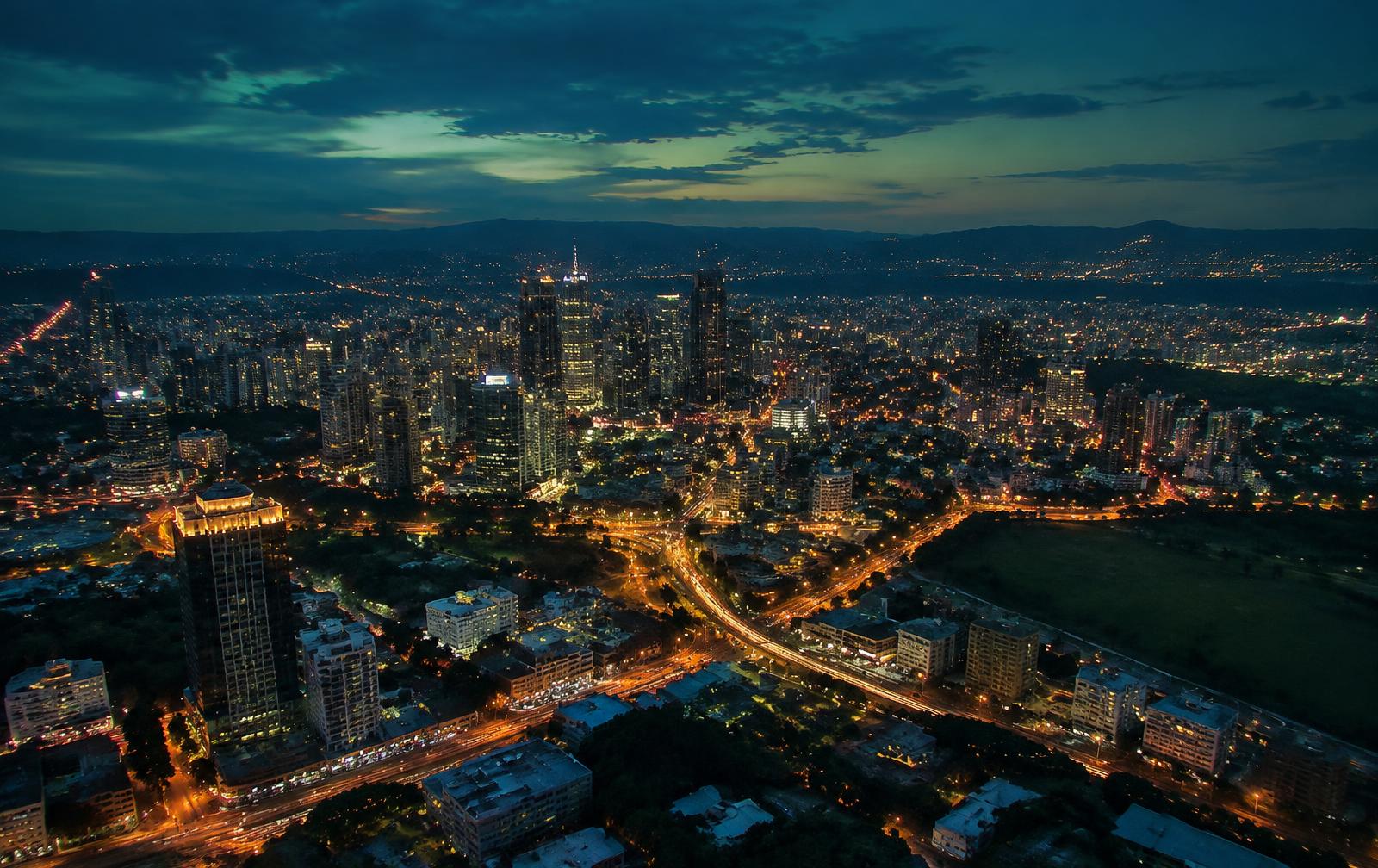 An African city skyline lit up at dusk